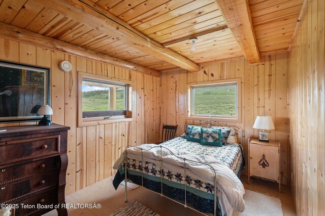 15 S Rainbow Dr, Cora, WY 82925 - bedroom with a wooden ceiling with exposed beams, multiple windows, and wood walls