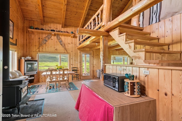 15 S Rainbow Dr, Cora, WY 82925 - living room featuring wooden walls, plenty of natural light, wooden ceiling, and carpet floors