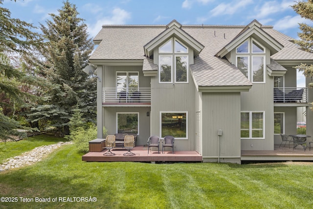 536 Shadow Brook Ln, Driggs, ID 83422 - back of property with a balcony, roof with shingles, a yard, and a wooden deck