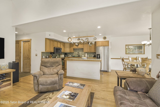536 Shadow Brook Ln, Driggs, ID 83422 - living area featuring light wood finished floors, a chandelier, and recessed lighting