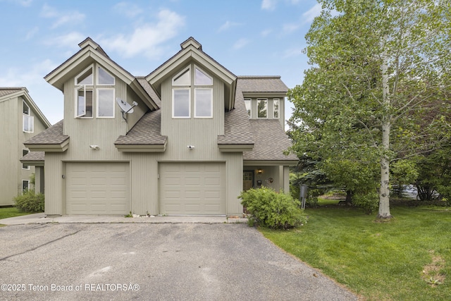 536 Shadow Brook Ln, Driggs, ID 83422 - view of front of house featuring roof with shingles, a garage, driveway, and a front yard