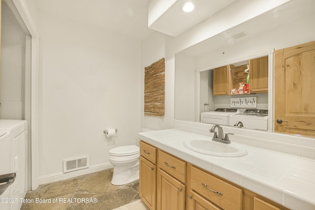 536 Shadow Brook Ln, Driggs, ID 83422 - bathroom with washing machine and clothes dryer and vanity