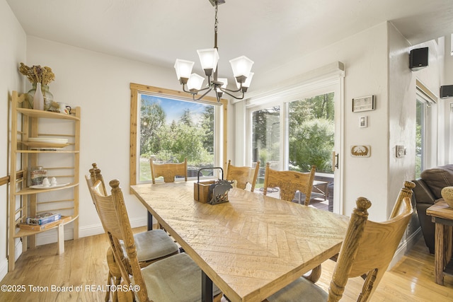 536 Shadow Brook Ln, Driggs, ID 83422 - dining area featuring a chandelier and light wood finished floors