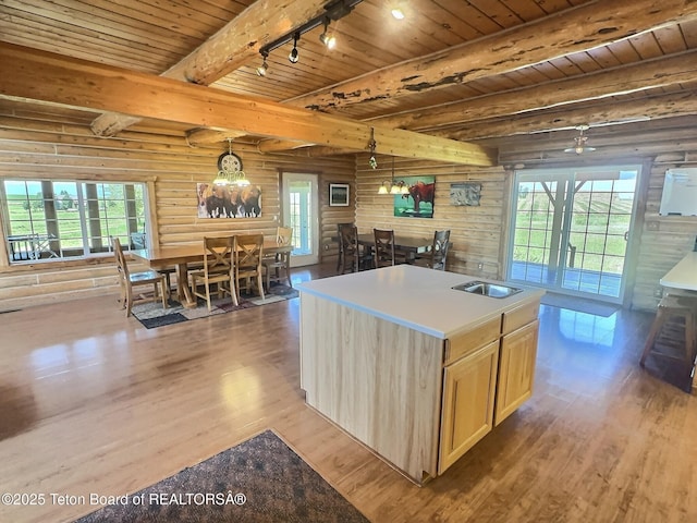 3525 W 13000 N, Felt, ID 83424 - kitchen featuring light wood-style flooring, light brown cabinets, a wooden ceiling with exposed beams, a chandelier, and healthy amount of natural light