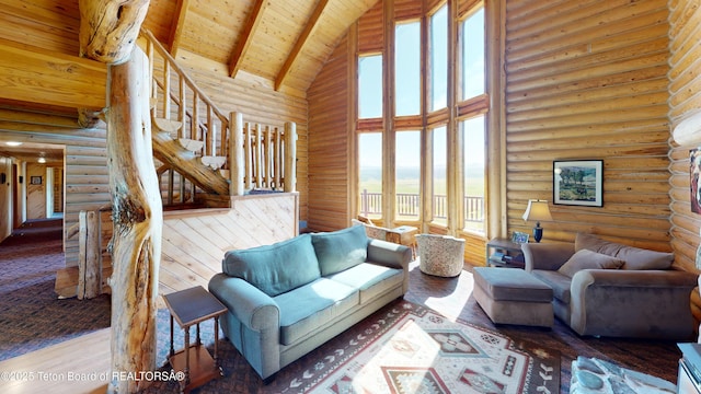 3525 W 13000 N, Felt, ID 83424 - living room with high vaulted ceiling, log walls, a wood ceiling with exposed beams, wood finished floors, and stairs