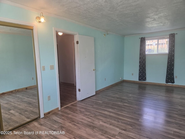 321 Smith Ave, Big Piney, WY 83113 - empty room with wood finished floors, a textured ceiling, and crown molding
