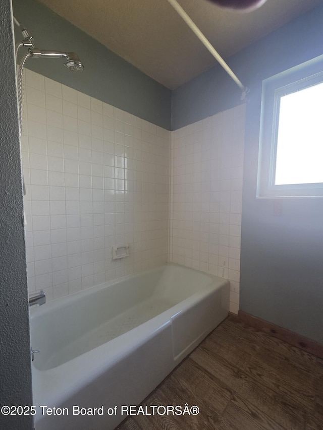 321 Smith Ave, Big Piney, WY 83113 - full bath with wood finished floors and tub / shower combination