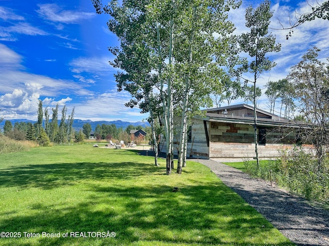 9632 Little Pine Ln, Victor, ID 83455 - view of grassy yard featuring a mountain view