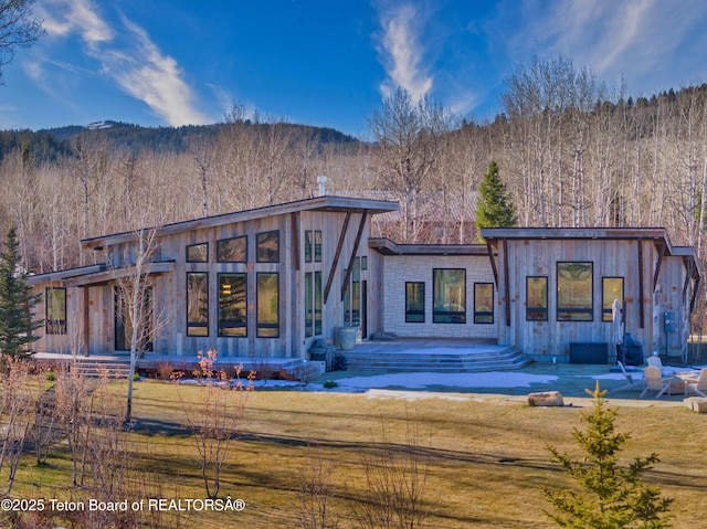 9632 Little Pine Ln, Victor, ID 83455 - rear view of house with a lawn, a mountain view, a forest view, and a patio area