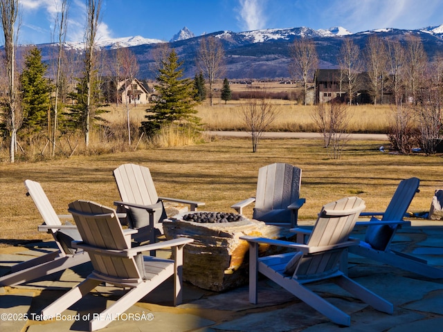 9632 Little Pine Ln, Victor, ID 83455 - view of patio / terrace with a fire pit and a mountain view