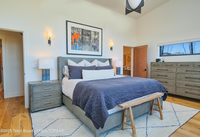 9632 Little Pine Ln, Victor, ID 83455 - bedroom with light wood finished floors and a high ceiling