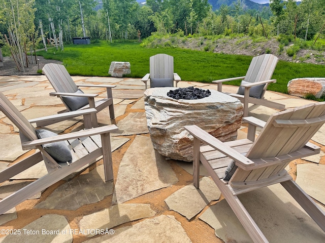 9632 Little Pine Ln, Victor, ID 83455 - view of patio featuring an outdoor fire pit and a forest view