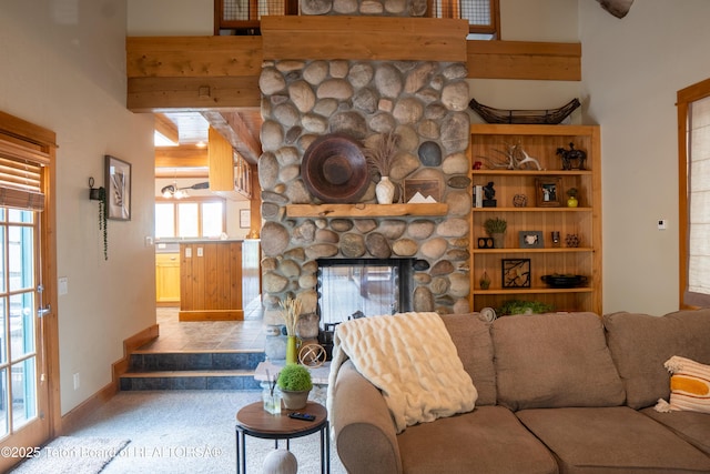 939 W Stuart St, Pinedale, WY 82941 - living area with a stone fireplace and baseboards