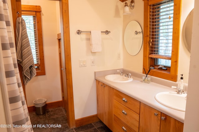 939 W Stuart St, Pinedale, WY 82941 - bathroom featuring double vanity, a heating unit, and tile patterned floors