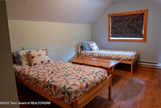 939 W Stuart St, Pinedale, WY 82941 - bedroom with baseboard heating, hardwood / wood-style flooring, and lofted ceiling