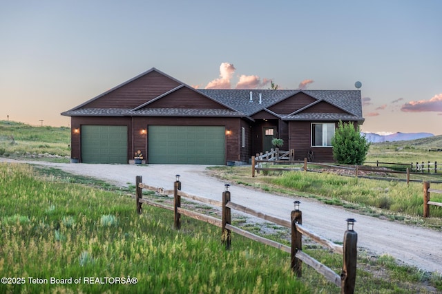 3 Healers, Pinedale, WY 82941 - ranch-style home with driveway, a garage, and roof with shingles