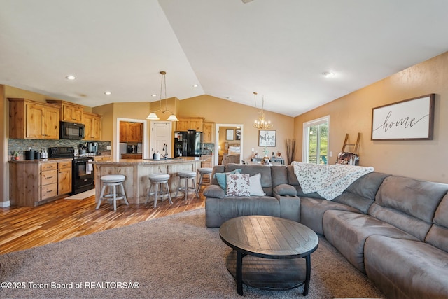 3 Healers, Pinedale, WY 82941 - living room with light wood-style floors, vaulted ceiling, and a chandelier
