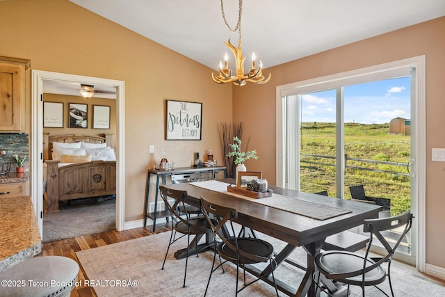 3 Healers, Pinedale, WY 82941 - dining space with a chandelier, lofted ceiling, and light wood-type flooring