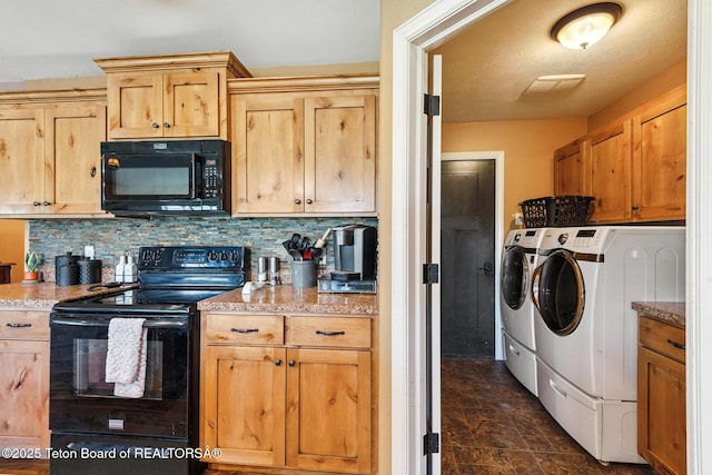 3 Healers, Pinedale, WY 82941 - kitchen with black appliances, separate washer and dryer, backsplash, light stone counters, and stone finish floors