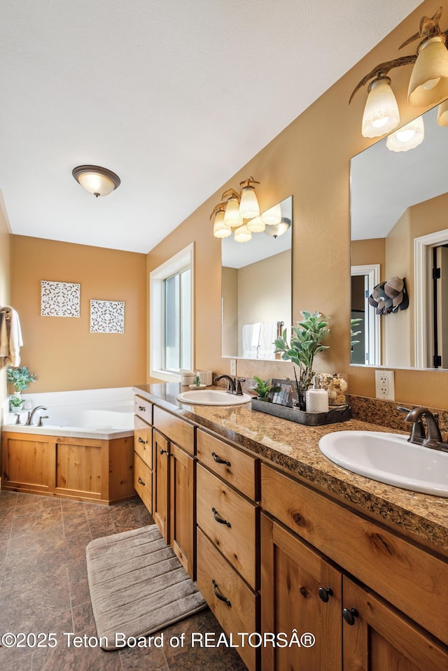 3 Healers, Pinedale, WY 82941 - bathroom featuring double vanity, a bath, and stone finish floors