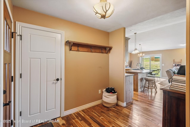 3 Healers, Pinedale, WY 82941 - hall featuring wood finished floors and a chandelier