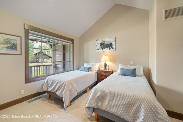 5862 N Coneflower Dr Unit 17, Jackson, WY 83001 - bedroom featuring carpet and high vaulted ceiling
