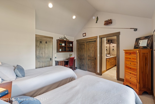 5862 N Coneflower Dr Unit 17, Jackson, WY 83001 - bedroom featuring light carpet, high vaulted ceiling, connected bathroom, and recessed lighting