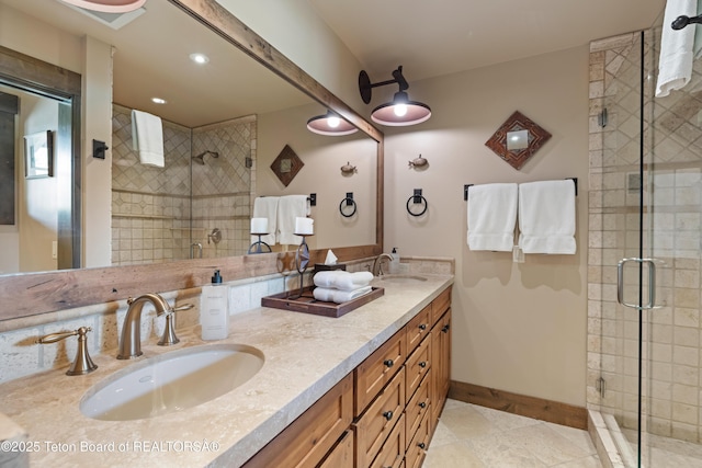 5862 N Coneflower Dr Unit 17, Jackson, WY 83001 - bathroom with a stall shower, double vanity, tile patterned floors, and recessed lighting
