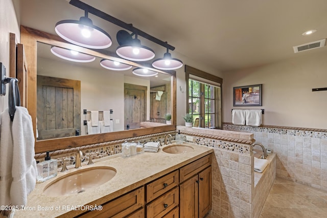 5862 N Coneflower Dr Unit 17, Jackson, WY 83001 - bathroom with double vanity, a bath, and tile patterned floors