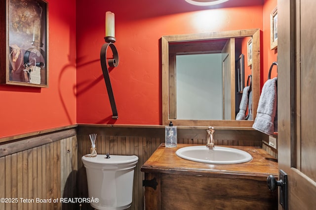 5862 N Coneflower Dr Unit 17, Jackson, WY 83001 - half bathroom featuring wainscoting and vanity