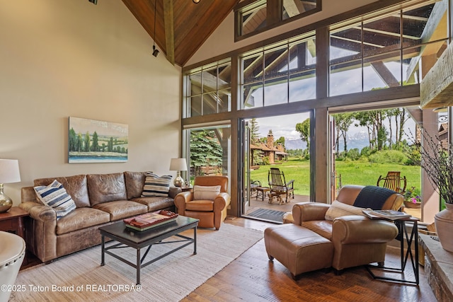5862 N Coneflower Dr Unit 17, Jackson, WY 83001 - living room featuring high vaulted ceiling, wood finished floors, and wood ceiling