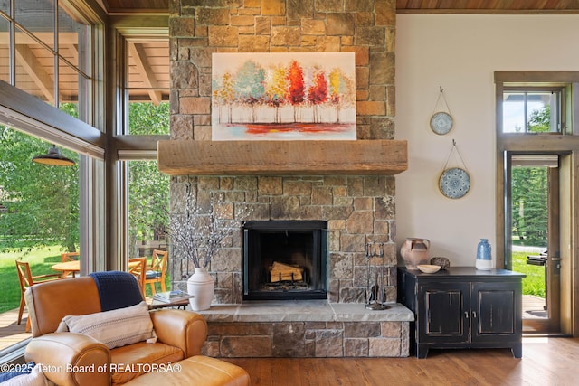 5862 N Coneflower Dr Unit 17, Jackson, WY 83001 - living room with wood finished floors and a stone fireplace