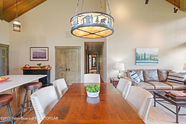 5862 N Coneflower Dr Unit 17, Jackson, WY 83001 - dining space with high vaulted ceiling and wood finished floors