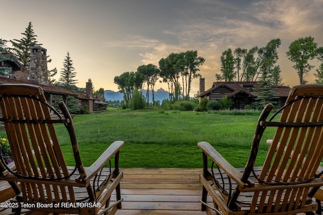 5862 N Coneflower Dr Unit 17, Jackson, WY 83001 - wooden terrace featuring a yard