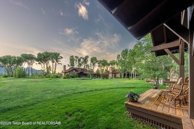 5862 N Coneflower Dr Unit 17, Jackson, WY 83001 - view of grassy yard featuring a wooden deck