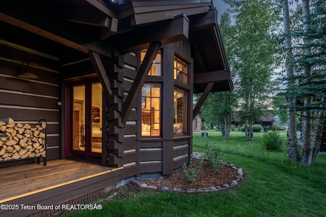 5862 N Coneflower Dr Unit 17, Jackson, WY 83001 - view of exterior entry with a lawn