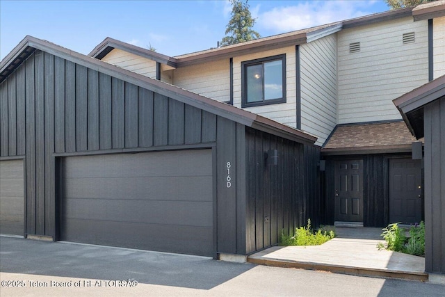 816 Powderhorn Ln Unit 816D, Jackson, WY 83001 - townhome / multi-family property with board and batten siding and a garage