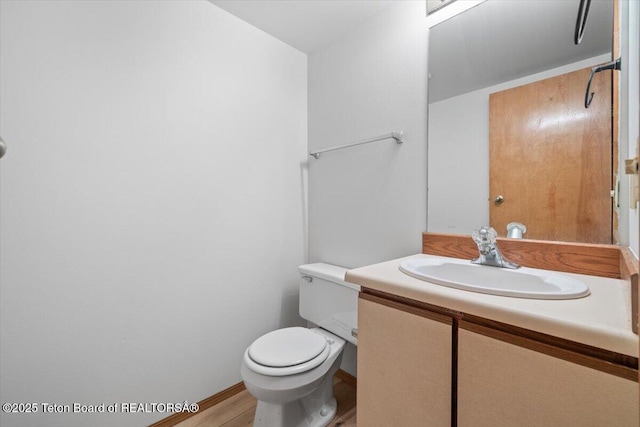 816 Powderhorn Ln Unit 816D, Jackson, WY 83001 - half bathroom featuring vanity and wood finished floors