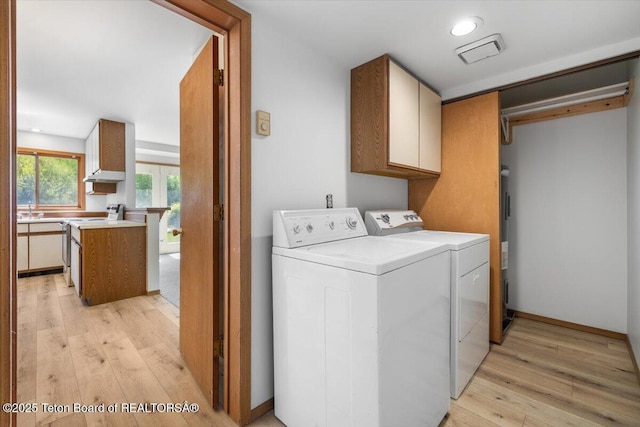 816 Powderhorn Ln Unit 816D, Jackson, WY 83001 - laundry room featuring cabinet space, light wood-style floors, washer and clothes dryer, and recessed lighting