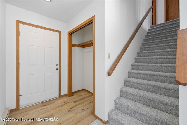 816 Powderhorn Ln Unit 816D, Jackson, WY 83001 - staircase with wood finished floors and baseboard heating