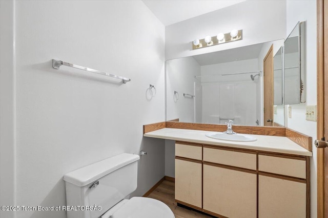 816 Powderhorn Ln Unit 816D, Jackson, WY 83001 - bathroom with vanity, wood finished floors, and a shower