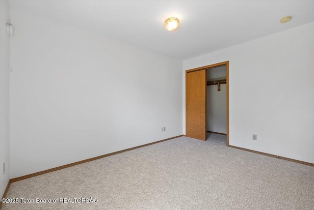 816 Powderhorn Ln Unit 816D, Jackson, WY 83001 - unfurnished bedroom with light carpet and a closet
