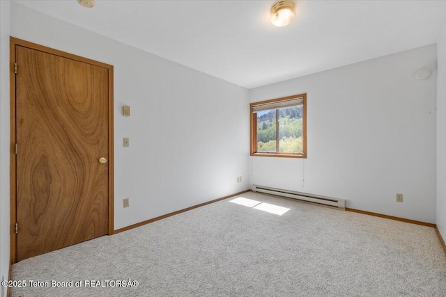 816 Powderhorn Ln Unit 816D, Jackson, WY 83001 - carpeted empty room featuring a baseboard heating unit and baseboards