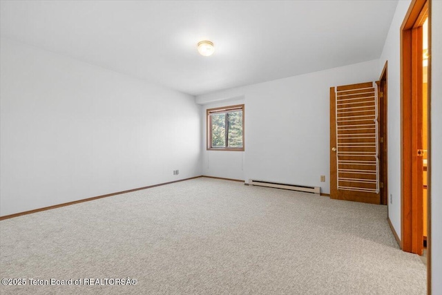 816 Powderhorn Ln Unit 816D, Jackson, WY 83001 - unfurnished bedroom with a baseboard radiator and light colored carpet
