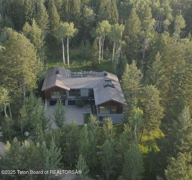 7970 N Granite Ridge Rd, Teton Village, WY 83025 - aerial view of property and surrounding area featuring a heavily wooded area