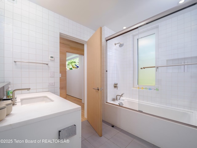 7970 N Granite Ridge Rd, Teton Village, WY 83025 - bathroom featuring tile walls, shower / bathtub combination, vanity, and tile patterned floors