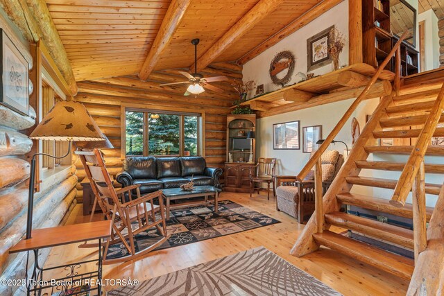 5100 Country Club Dr, Victor, ID 83455 - living room featuring rustic walls, stairway, wood ceiling, hardwood / wood-style floors, and ceiling fan