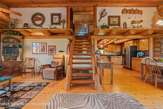 5100 Country Club Dr, Victor, ID 83455 - stairs with log walls, wood-type flooring, and wooden ceiling