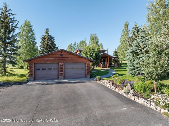5100 Country Club Dr, Victor, ID 83455 - view of front of property featuring a front lawn and log exterior