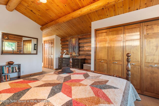 5100 Country Club Dr, Victor, ID 83455 - carpeted bedroom featuring rustic walls, wood ceiling, and two closets